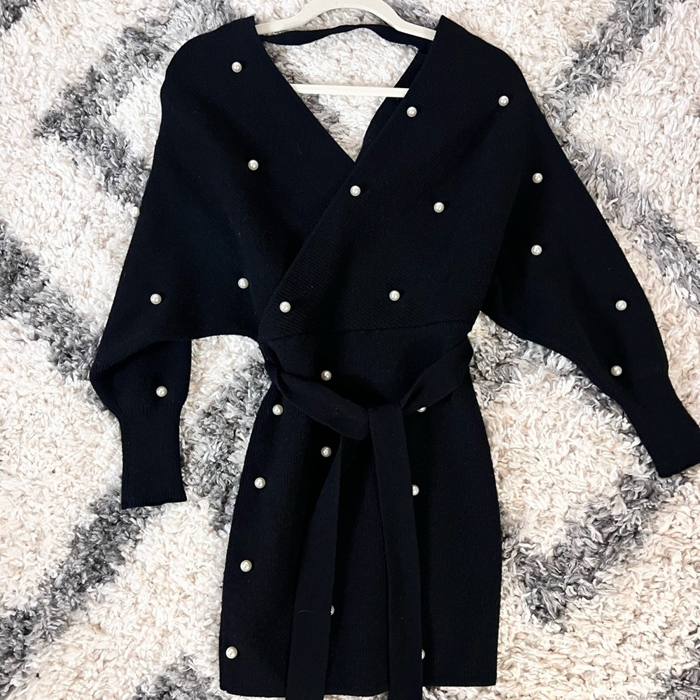 Black mini dress with white pearls